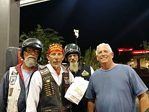 Mike, "Joker" Courtright, Mike "Point Man" Privatt, and Ray "Videographer" Trosper getting Charley a burger before leaving Yuma. Arizona